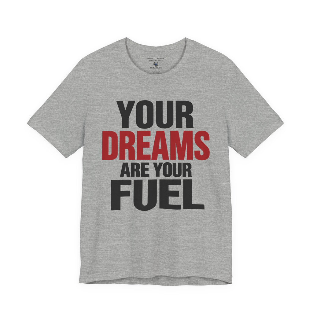 A athletic gray short-sleeve t-shirt with a graphic text print reading 'YOUR DREAMS ARE YOUR FUEL' in black and red lettering, displayed on a solid white background.
